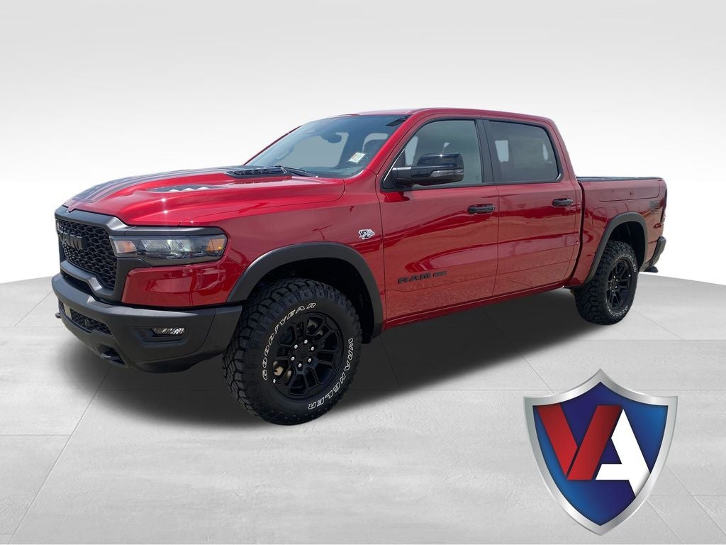 2026 RAM Ram 1500 RAM 1500 REBEL CREW CAB 4X4 5'7' BOX in Molten Red Pearl-Coat Exterior Paint — front three-quarter view