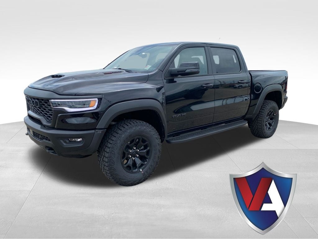 2026 RAM Ram 1500 RAM 1500 RHO CREW CAB 4X4 5'7' BOX in Diamond Black Crystal Pearl-Coat Exterior Paint — front three-quarter view