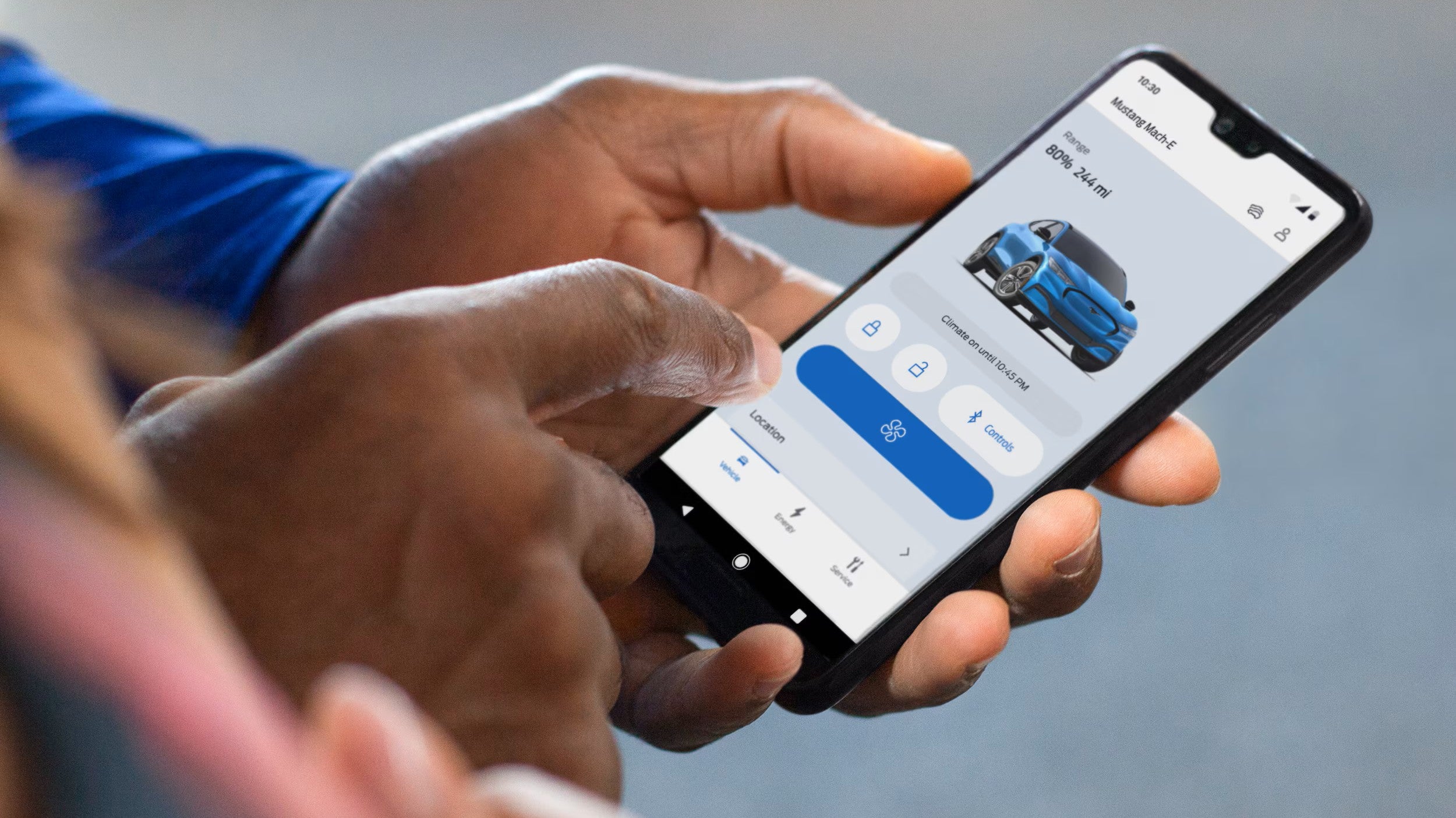 a person looking at the fordpass app on their phone